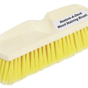 Yellow plastic-handled wood staining brush with dense yellow bristles; label reads 'Restore-A-Deck Wood Staining Brush' on top edge.